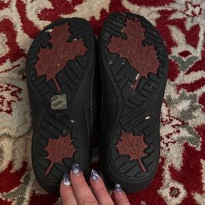 Black Shoes with Leaf Pattern Soles they are aetrex